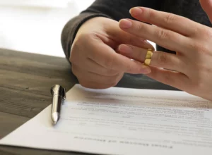 woman signing the divorce decree